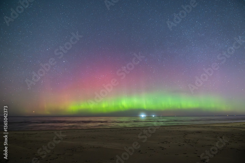 Fototapeta Naklejka Na Ścianę i Meble -  Aurora Borealis northen lights on the Baltic Sea beach in Latvia