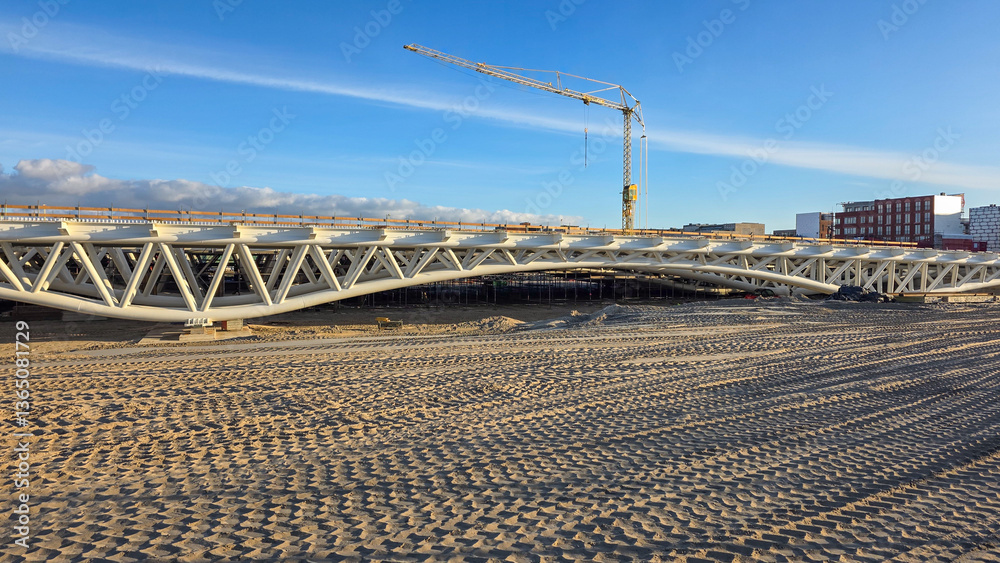 Steel bridge under construction and tire marks