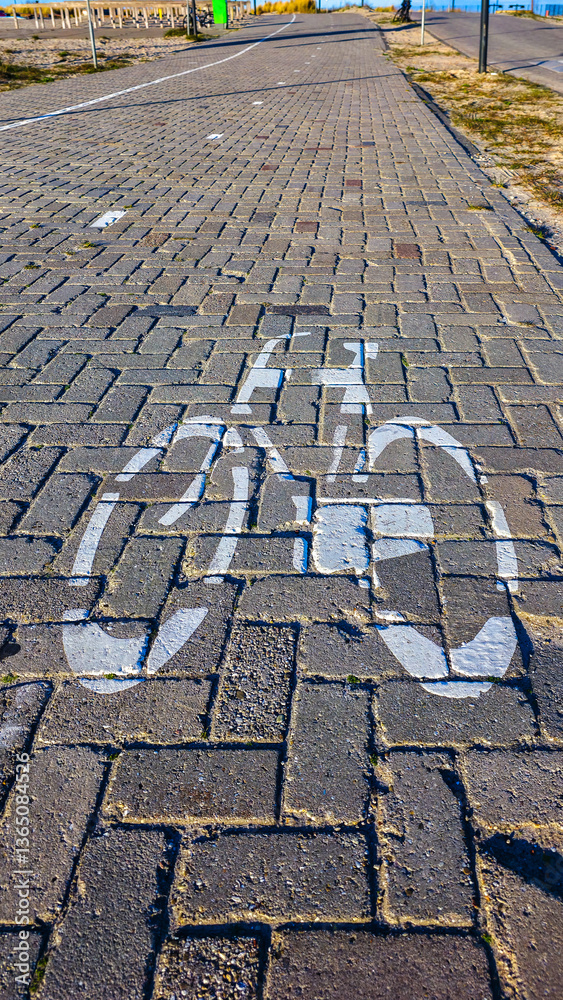 Bicycle path marking on cobblestone