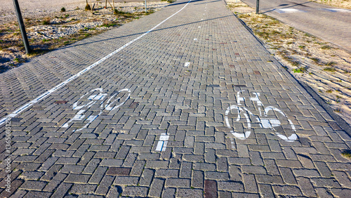 Bicycle path markings on cobblestone