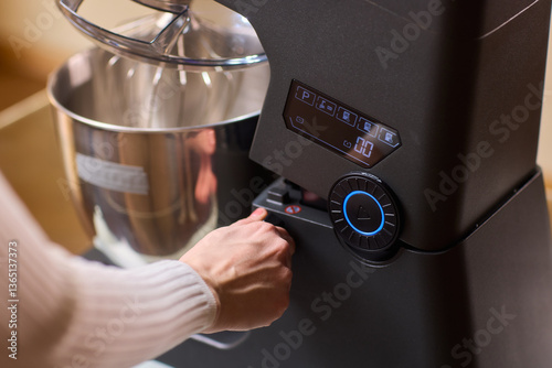 The Modern Kitchen Mixer Control Panel is currently in use for preparation and cooking activities