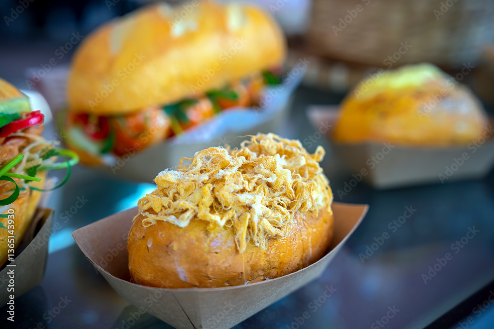 Homemade bun of bread with mayonnaise and pork floss on wood tray