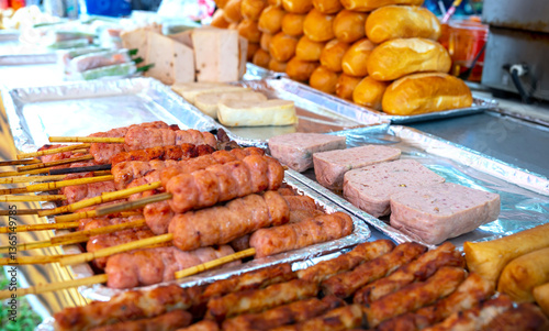 Obraz na płótnie Nem lui fue, grilled minced pork sausages on lemongrass skewers, Vietnamese cuisine w salonie