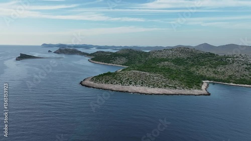 Hilly green islands in Kornati archipelago in Croatia, aerial pull-out