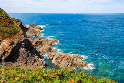 Cliffs near Cancale, Brittany, France. Emerald coast. Breton landscape. Summer nature travel background.
