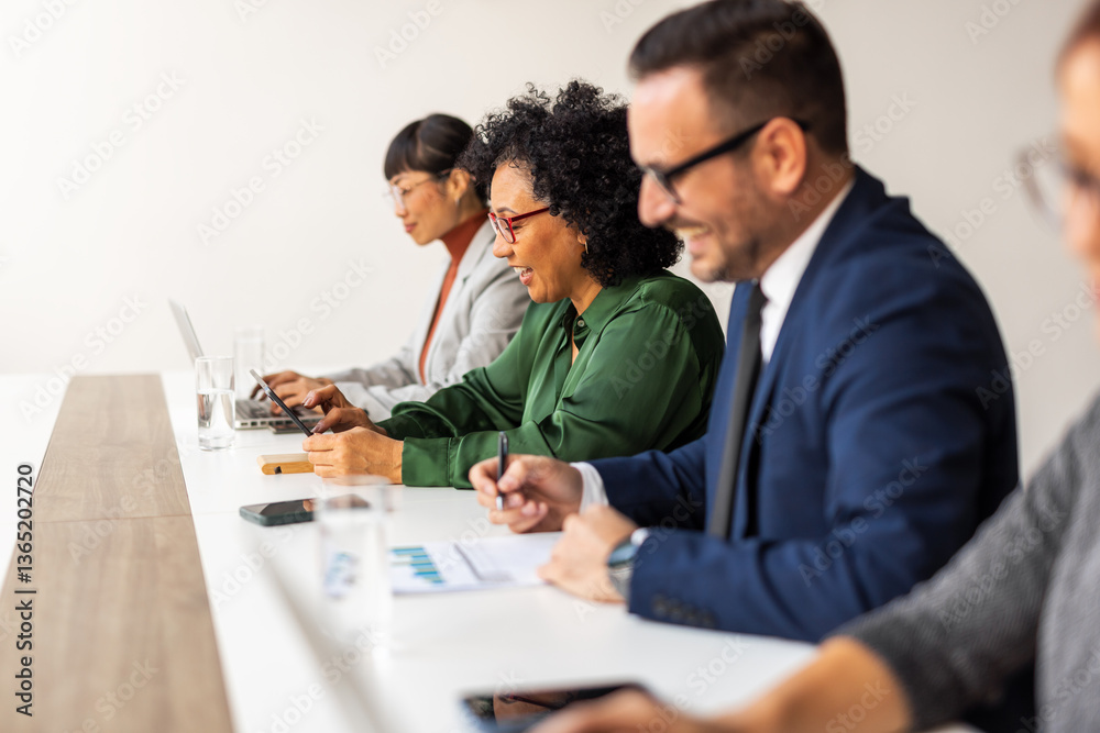 Professional Team Meeting in Modern Office Setting Professional Team Meeting in Modern Office Setting