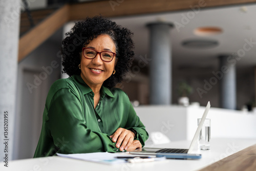 Professional Woman Working in Modern Office Environment with Laptop