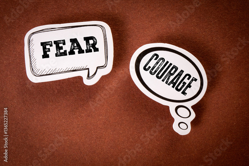 Canvas Print Fear vs Courage Concept with Thought Bubbles on Brown Background