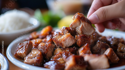 Close-up of super crispy and shiny lechon skin, juicy meat chunks still steaming on a plate, someone's hand pinching the crispy skin, Ai generated images