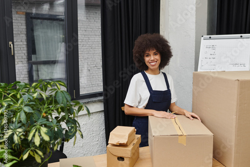 Packing boxes and organizing belongings in a modern living space during a busy moving day