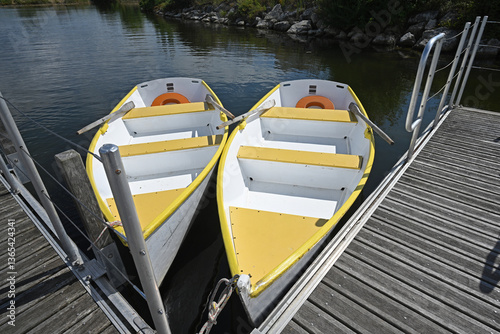Wallpaper Mural two empty boats side by side on a body of water Torontodigital.ca
