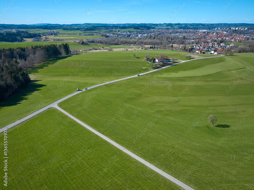 Fototapeta premium aerial spring landscape with wide green meadows in the Western Allgäu near City of Wangen, Baden-Wuerttemberg, Germa