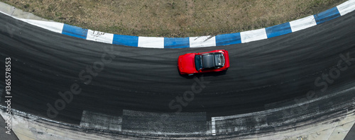 Obraz na płótnie Top view car drift on asphalt race track with lot of smoke from burning tires rubber, Drift motor sport car drift race, Professional driver drift car on asphalt race track. w salonie