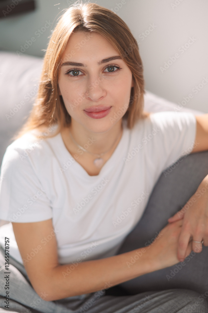 Portrait, young and woman 20s at house with smile to relax in living room as student for break on weekend. Happy, carefree and female person with confident comfort in campus dorm for calm peace Portrait, young and woman 20s at house with smile to relax in living room as student for break on weekend. Happy, carefree and female person with confident comfort in campus dorm for calm peace