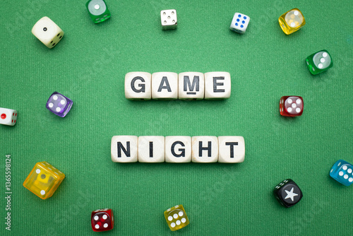 Obraz na plátně Word dice showing the phrase 'Game Night', with a selection of colourful dice around it on a vibrant green baize fabric