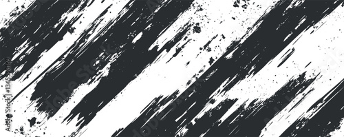 Abstract grunge brush stroke texture in black and white for edgy design projects.