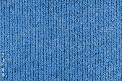 Texture of velour jacquard blue fabric coarse weave close up, macro woven coarse. Textile background, furniture textile material, wallpaper, backdrop. Cloth structure close up, macro.