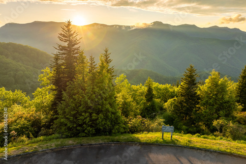 Road trip travel in Appalachian mountains at sunset. Mt. Mitchell Overlook on parkway and woods nature in summer season. Colorful forest in North Carolina photo