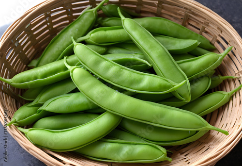 A basket of fresh, tender snow peas, each pod perfectly plump.
