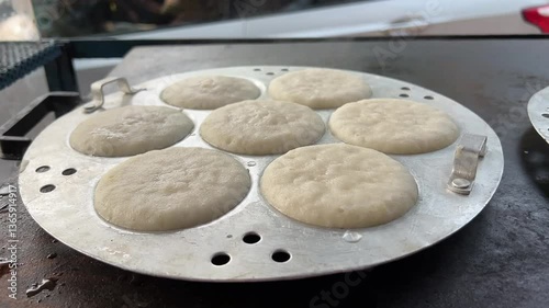 Close up shot of Idli being prepared in a road side stall in India