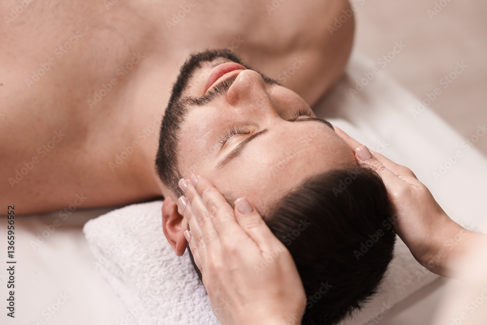 Man receiving relaxing massage in spa salon Man receiving relaxing massage in spa salon