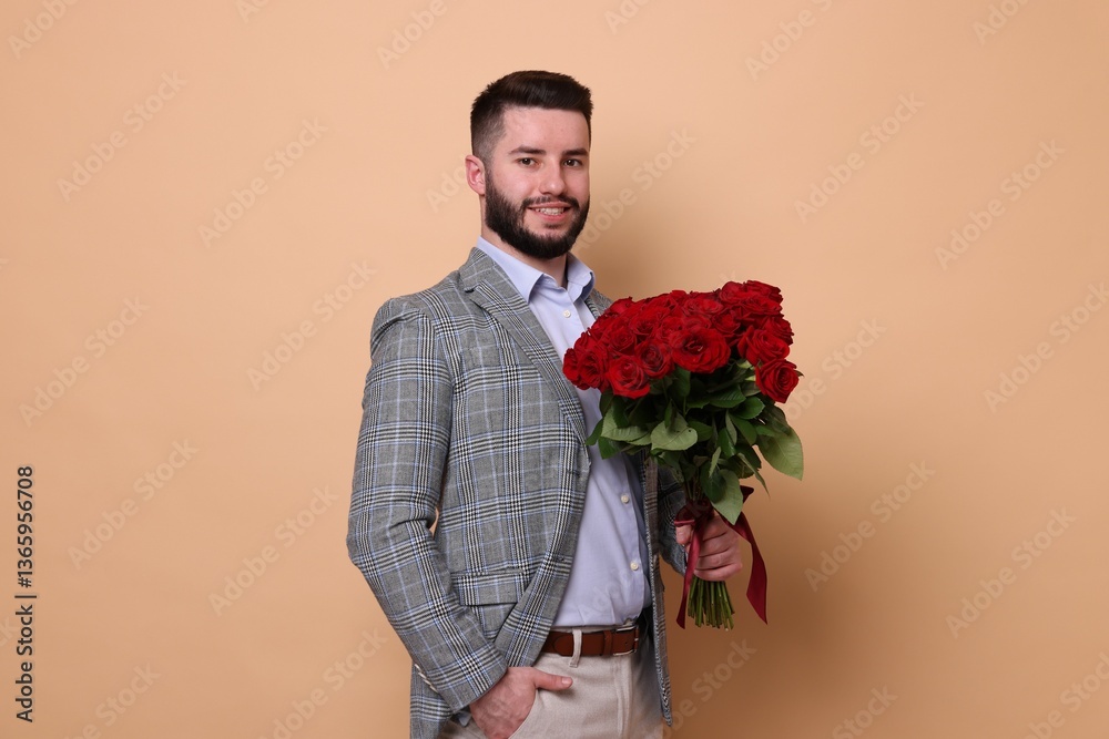 Happy man with bouquet of red roses on beige background Happy man with bouquet of red roses on beige background