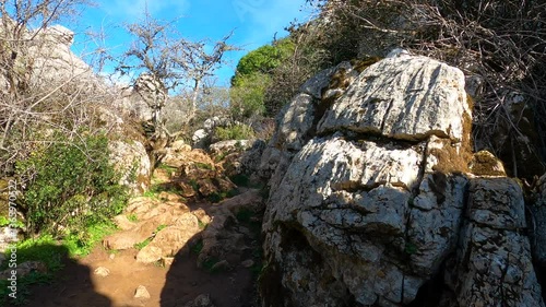Hiking in the Torcal de Antequerra National Park, limestone rock formations and known for unusual karst landforms in Andalusia, Malaga, Spain.