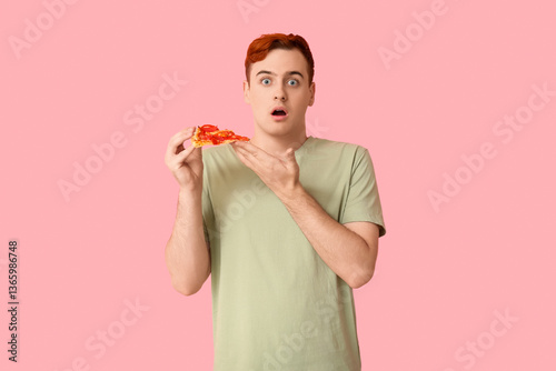 Shocked young man holding p...