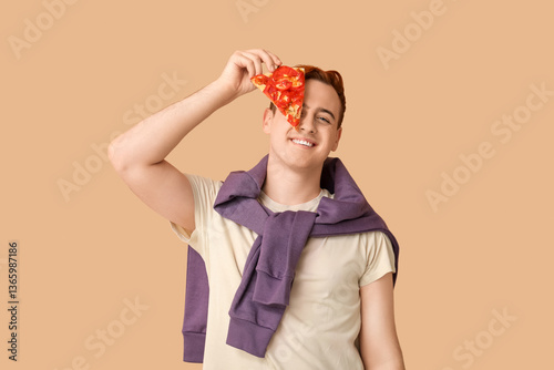 Young man holding piece of ...