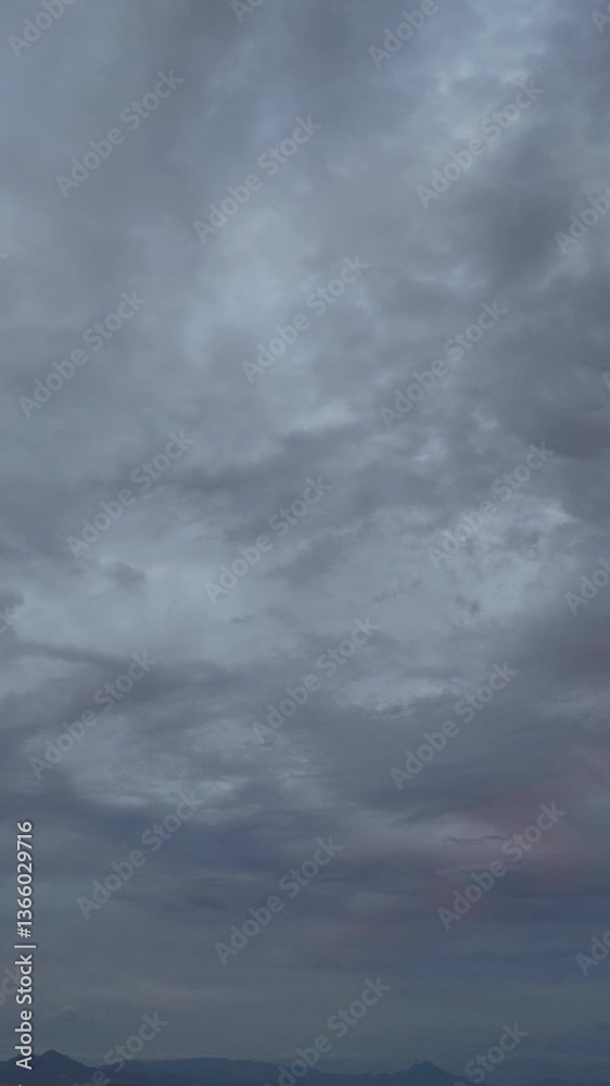 Overcast sky timelapse, showcasing the movement of dense clouds in a gray atmosphere Overcast sky timelapse, showcasing the movement of dense clouds in a gray atmosphere