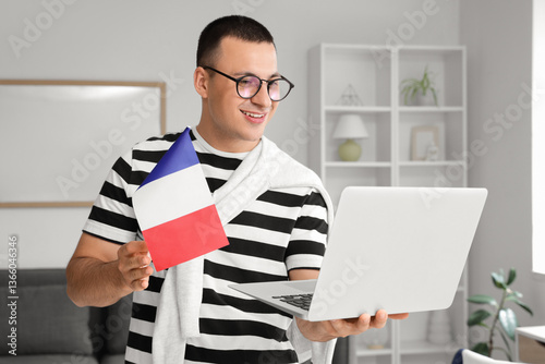 Young man with flag of Fran...