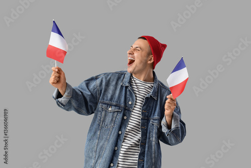 Happy young man with flags ...