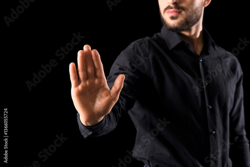Businessman showing stop ge...