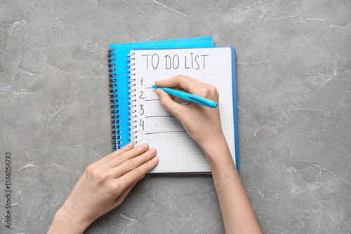 Person writing a to do list...