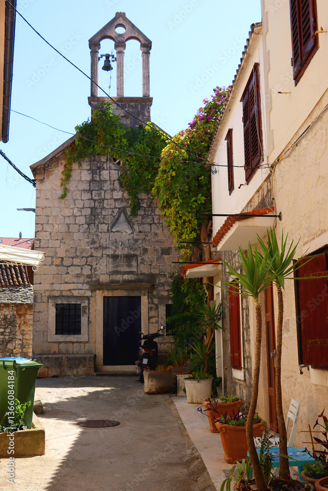 Picturesque Mediterranean street and traditional architectural details in Trogir, Croatia.