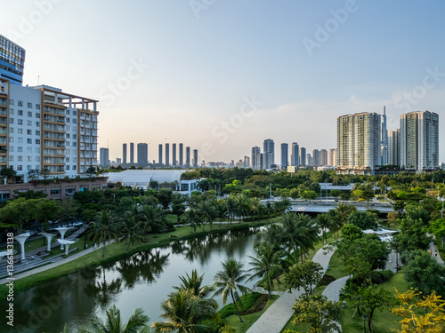 Принти на полотні modern green urban park with green lawns and palm trees in downtown of big city