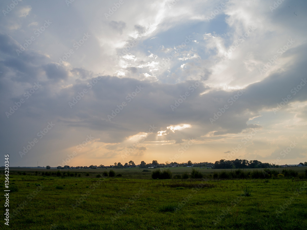 the sun's rays break through the clouds the sun's rays break through the clouds