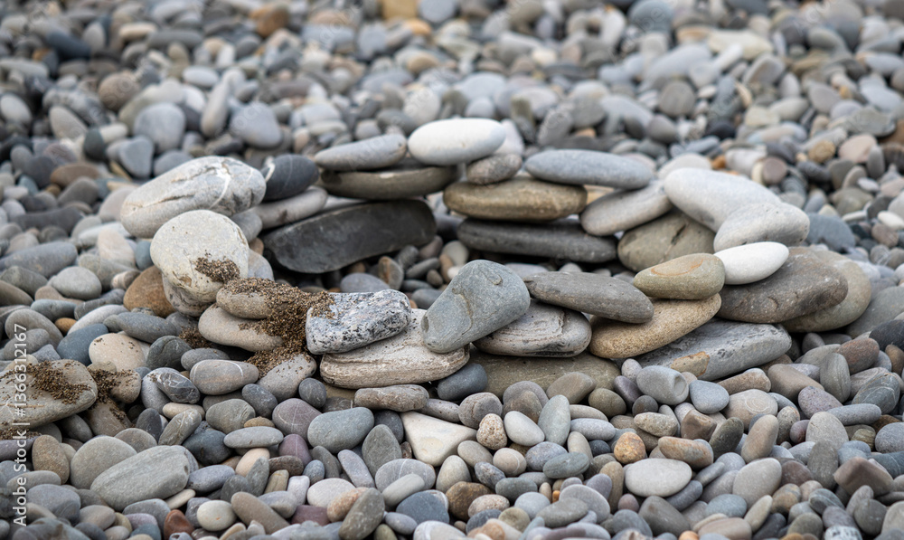 A pile of rocks with a small hole in the middle A pile of rocks with a small hole in the middle