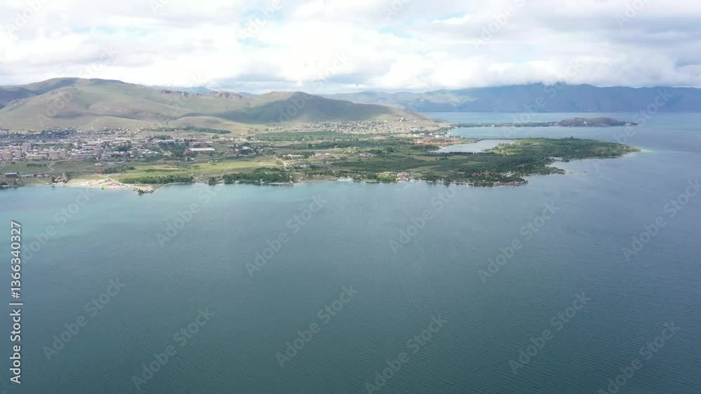 Scenic view of an island where settlements nestled within the natural landscape Scenic view of an island where settlements nestled within the natural landscape