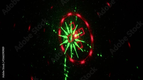 Moving drawings with rays of light of green and red colors on a black background