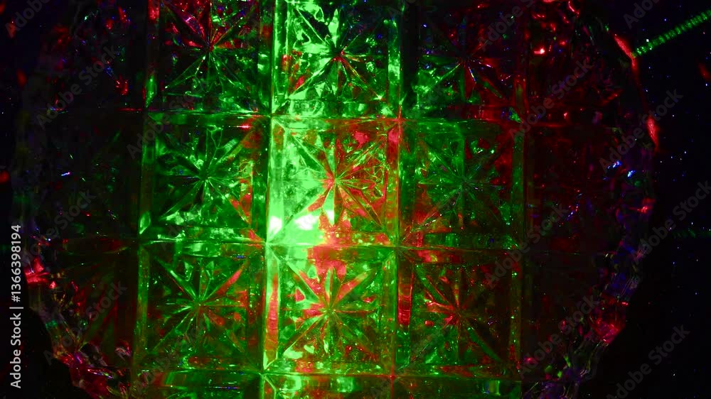 Intro for a rhythmic music video. Green and red lights through a crystal pattern.