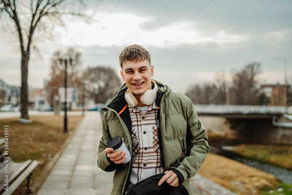 Fototapeta premium Young adult man student smile and search through his backpack 
