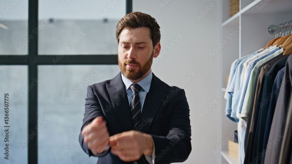 Fototapeta premium Smiling businessman buttoning blazer wardrobe closeup. Man wearing formal suit
