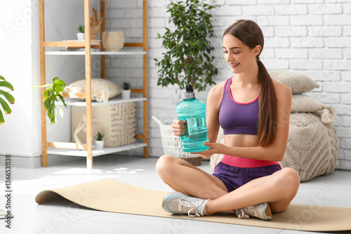 Sporty young woman with bot...