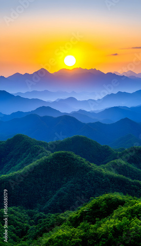 Sunrise over layered mountain ranges