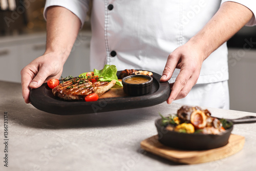 Εκτύπωση καμβά Professional chef serving dish at table indoors, closeup