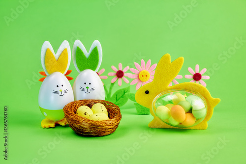female rabbit with eggs inside came to visit family of funny Easter bunnies with nest with yellow eggs and floral decor on green background
