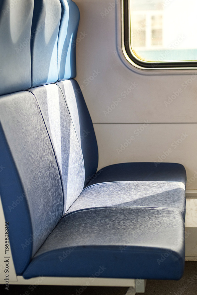 Empty Blue Seat Inside the Train Car with Sunlight from the Window. Empty Blue Seat Inside the Train Car with Sunlight from the Window.