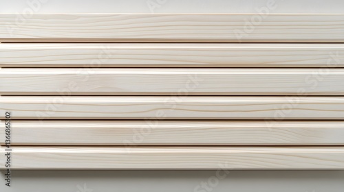 A clean and minimalist backdrop featuring an arrangement of light colored wooden planks positioned horizontally creating a simple and natural texture