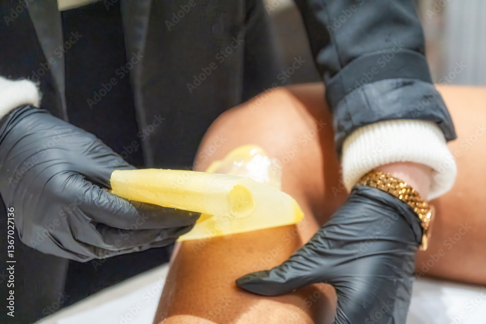 Professional leg hair removal treatment for women in a modern beauty salon